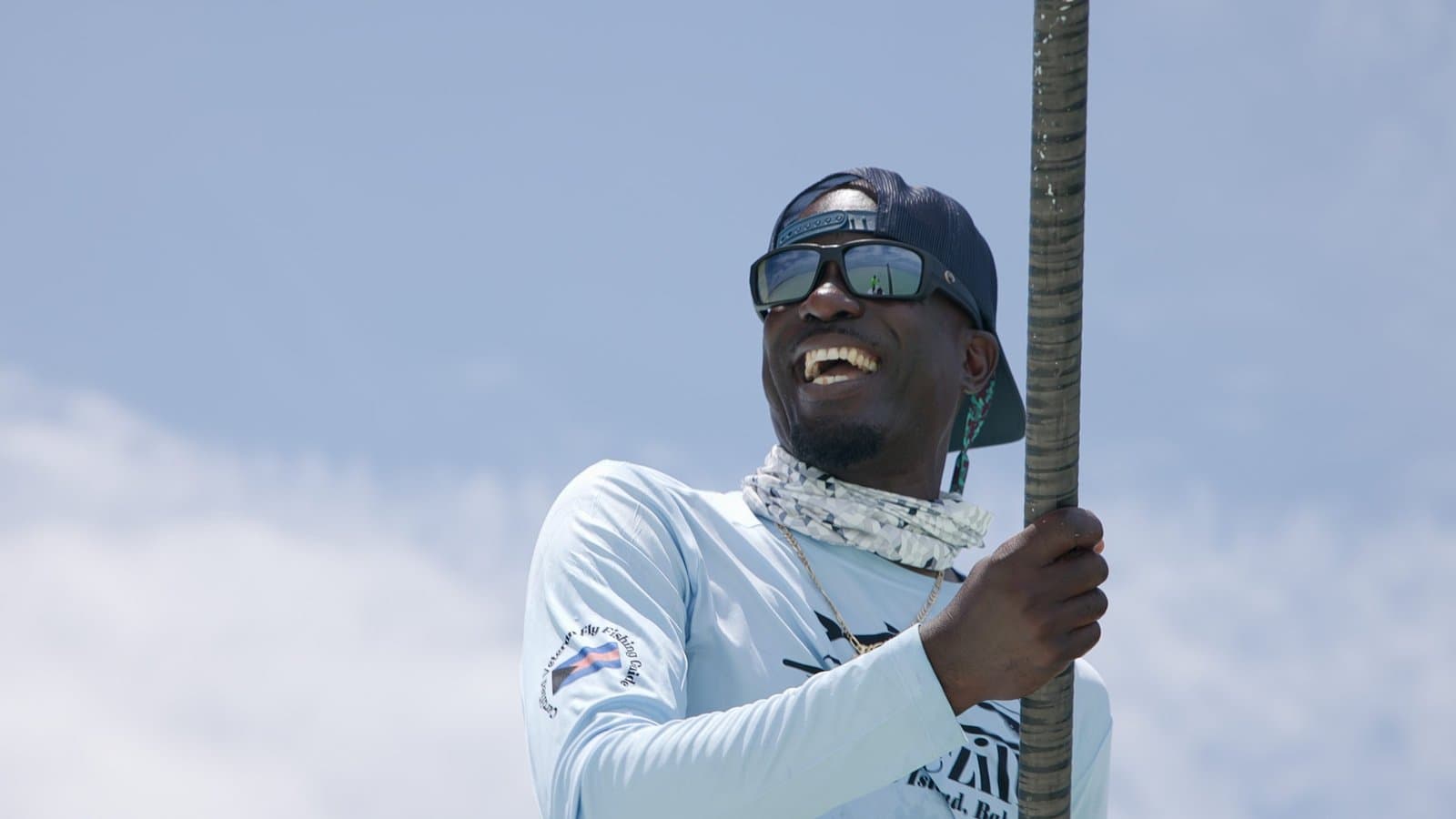 Captain Shawn Leadon at the helm of his flats boat on Andros
